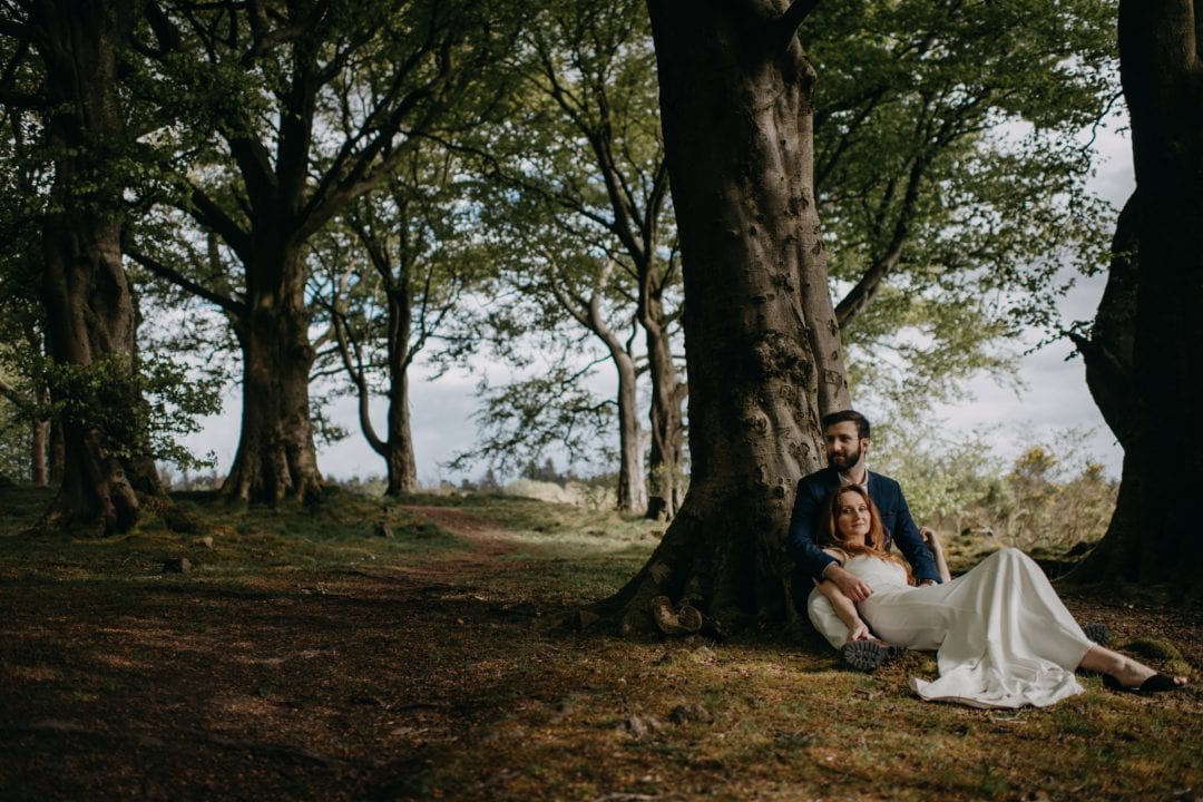 Adventure session in nature Scotland by trees. Lena Sabala and Patrick Zaarour on Mark Pacura workshop.
