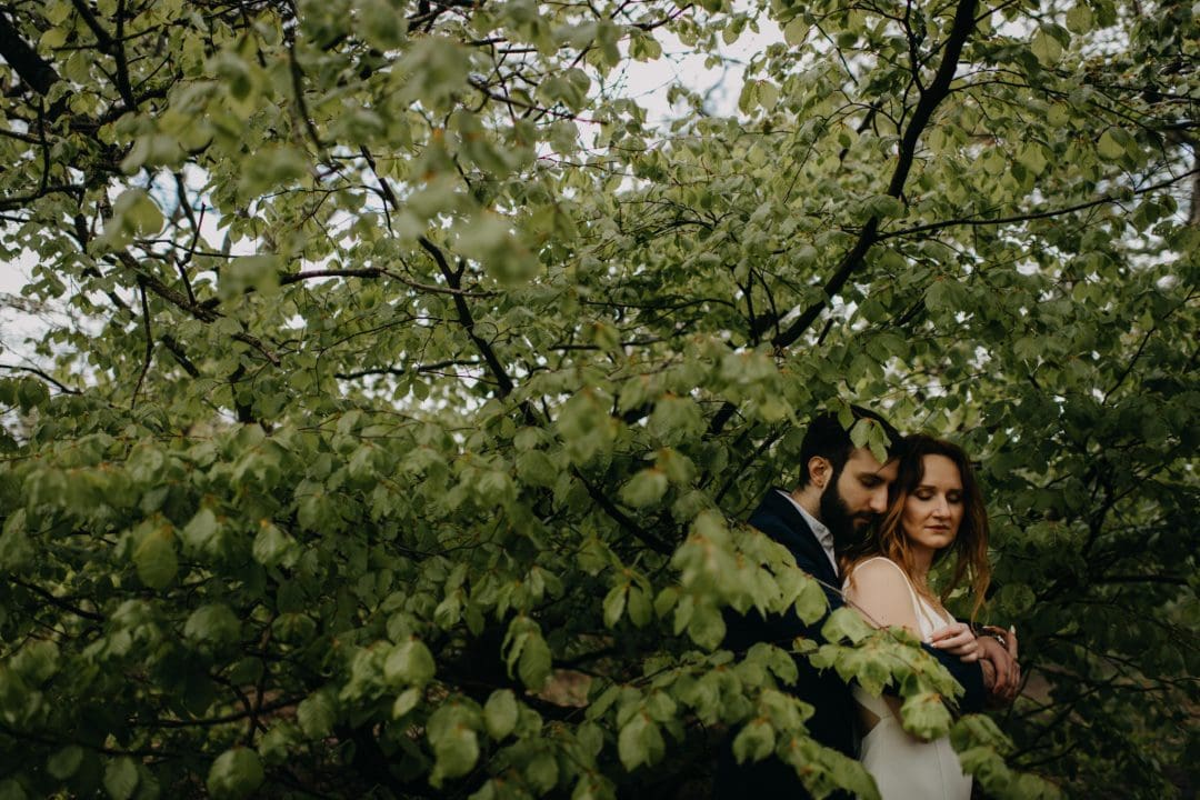 Couple shoot in nature Scotland by trees. Lena Sabala and Patrick Zaarour on Mark Pacura workshop.