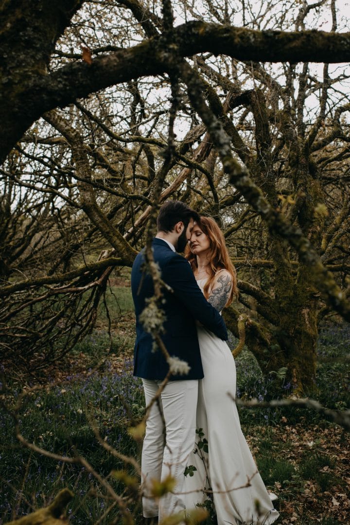 Couples shoot in nature Scotland by trees. Lena Sabala and Patrick Zaarour on Mark Pacura workshop.