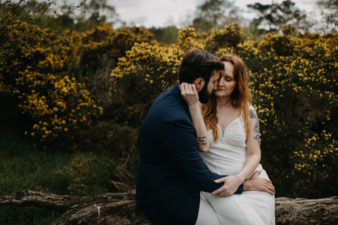Couples shoot in nature Scotland by trees and gorse bushes. Lena Sabala and Patrick Zaarour on Mark Pacura workshop.