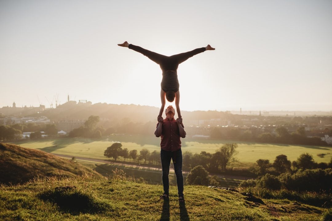 Acrobalance couple during couples connection photoshoot in Edinburgh - Holyrood Park