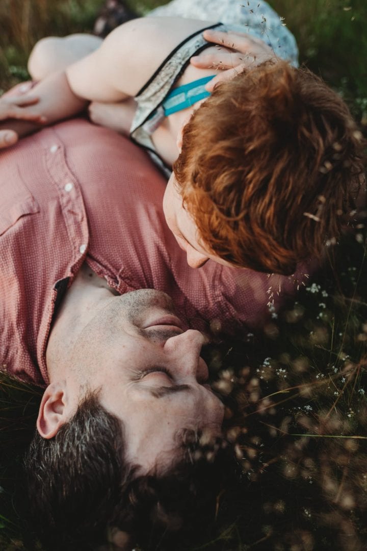 Couple in Holyrood Park, Edinburgh lying down