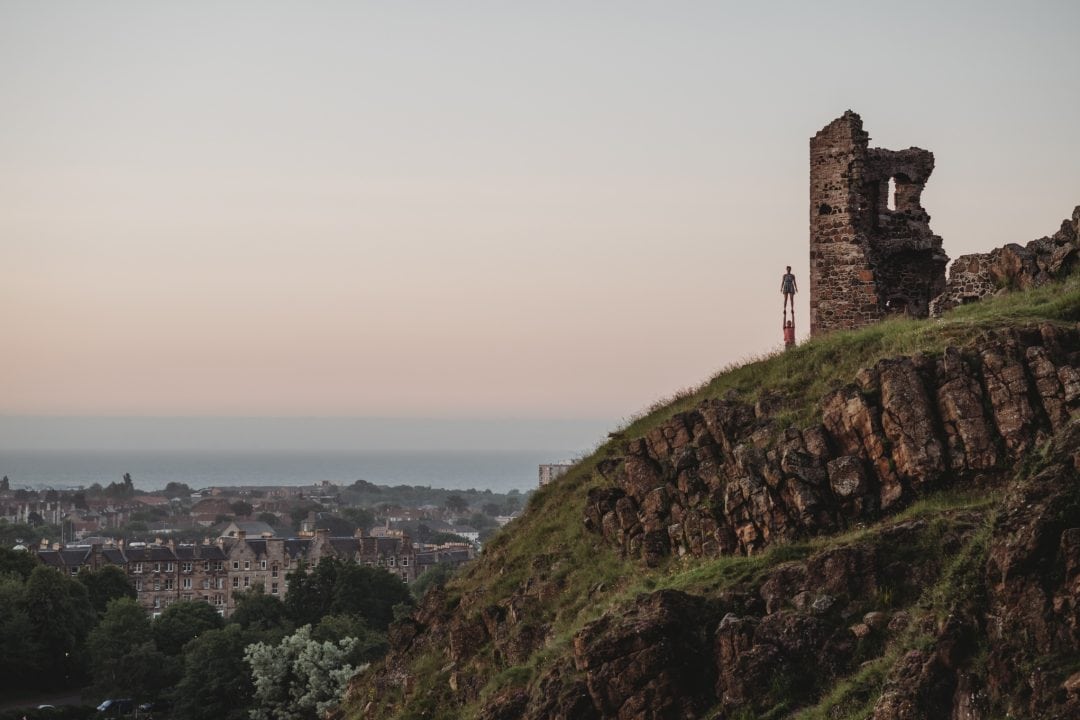 Acrobalance couple during couples connection photoshoot in Edinburgh - Holyrood Park