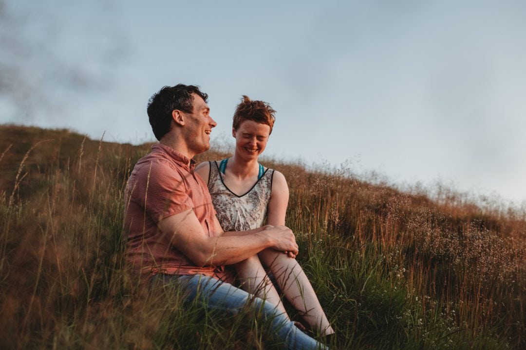 Couple laughing together in Holyrood Park