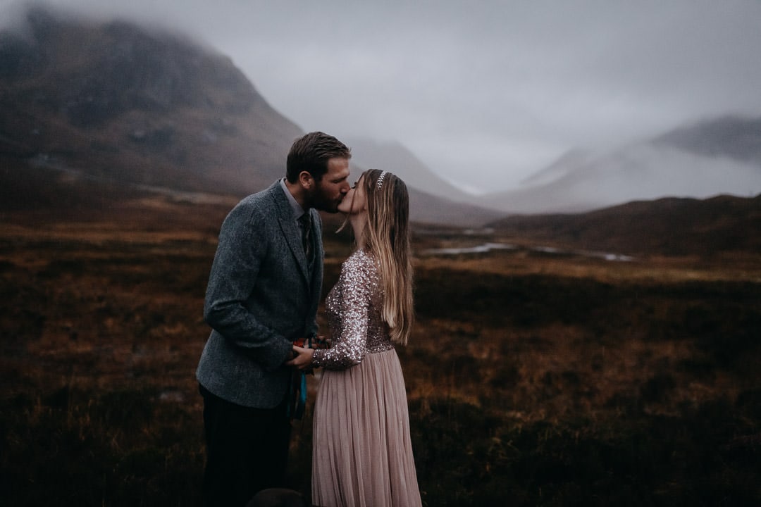 Engagement commitment ceremony handfasting in foggy Glencoe, Scotland