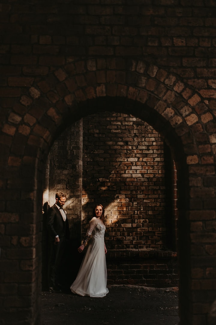 Dramatic photo of wedding couple underneath the National Mining Museum wedding venue - scottish elopement photographer