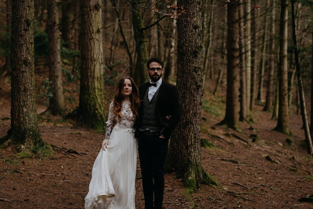 Wedding couple walking through Scottish forest during elopement - Scottish elopement photographer