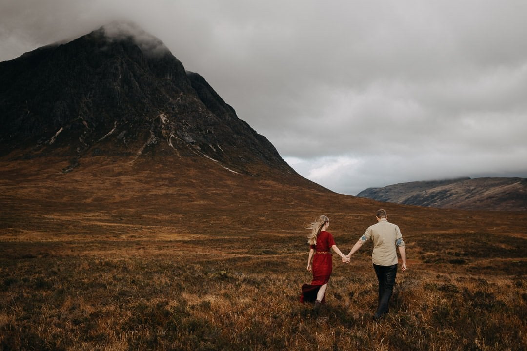 couple walking through the scottish highlands - adventure session near Glencoe