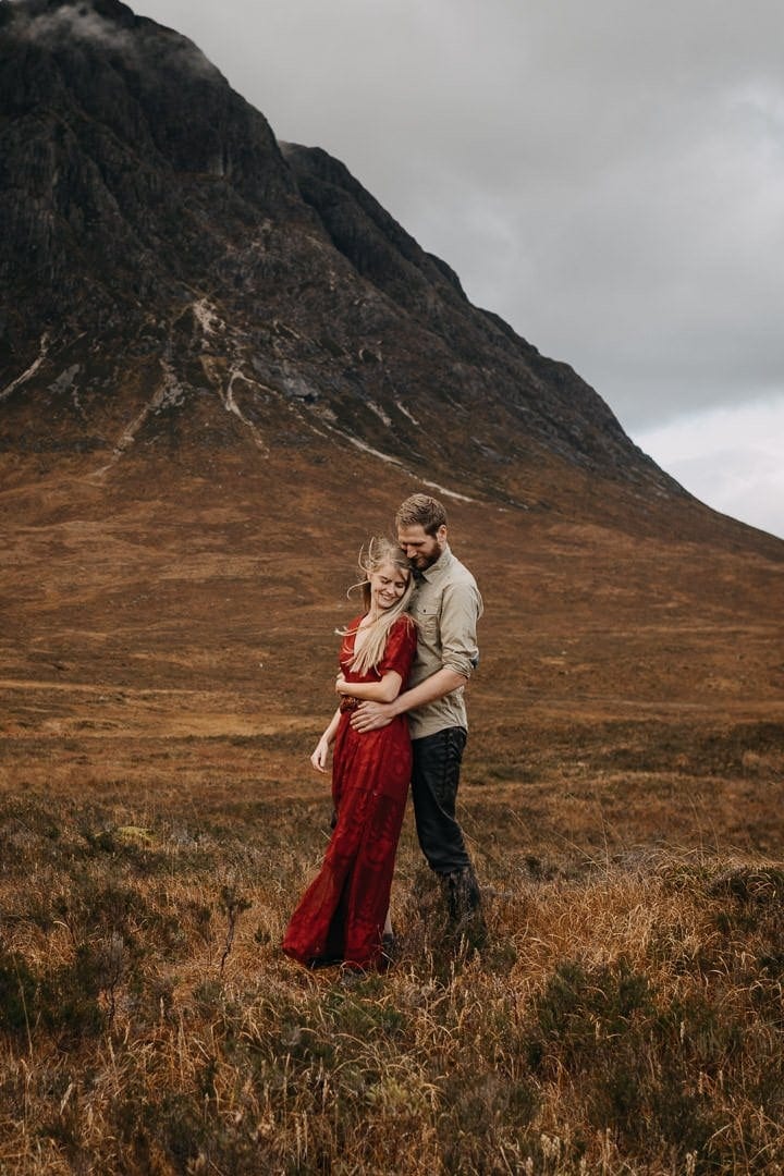 Happy couple in Buachaille Etive Mòr near Glencoe in the Scottish Highlands who are on an adventure session