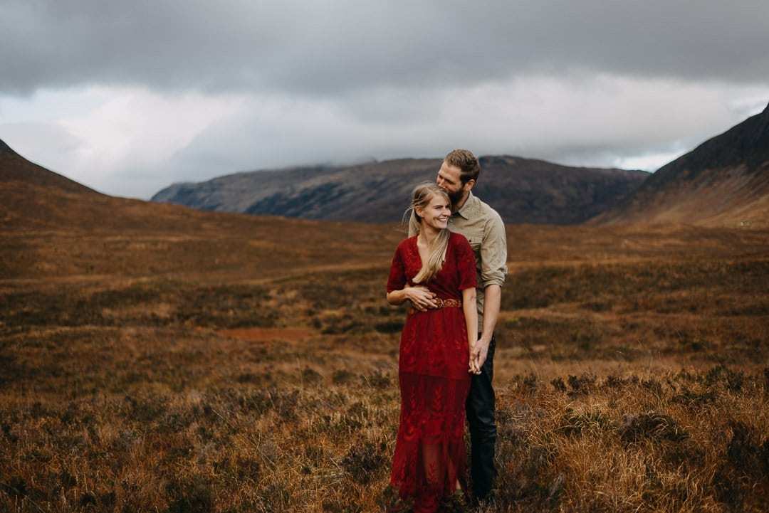 Happy couple in Buachaille Etive Mòr near Glencoe in the Scottish Highlands who are on an adventure session
