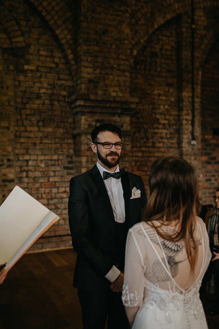 Happy grooms saying vows at quirky Scottish venue