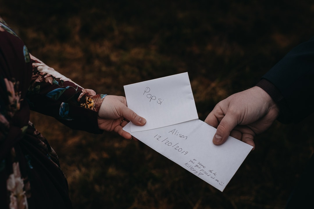 Handfasting ceremony vows during romantic winter Glencoe adventure elopement