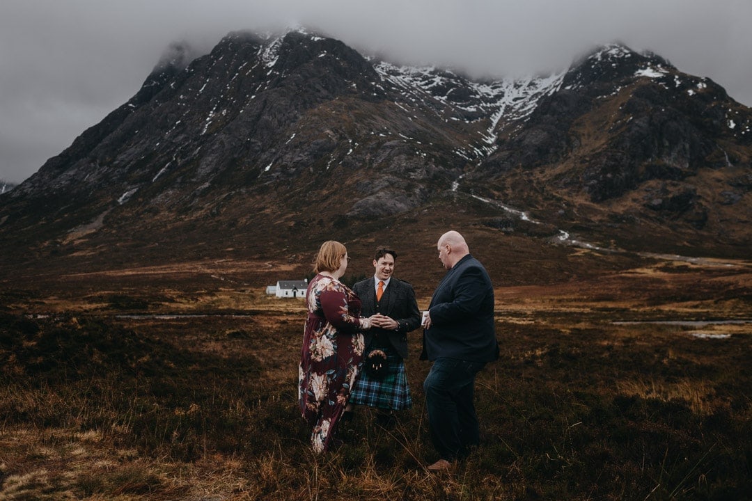 Handfasting ceremony during romantic winter Glencoe adventure elopement