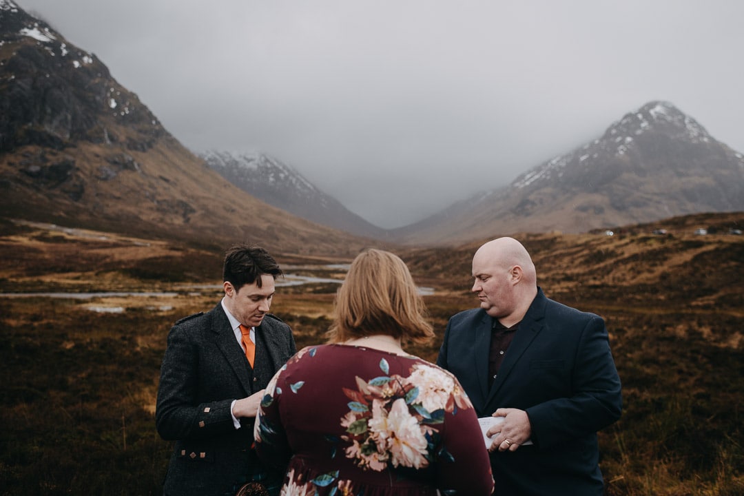 Drinking from quaich for handfasting ceremony during Glencoe adventure elopement