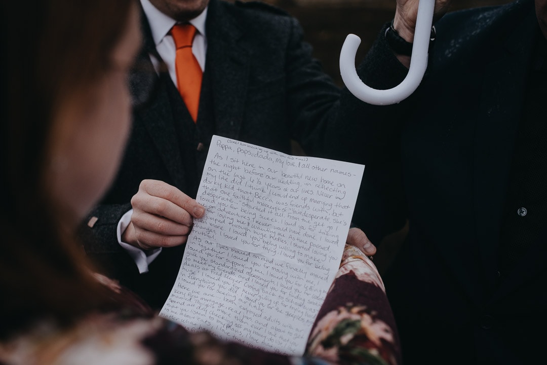 Romantic handfasting letter in Glencoe during wedding anniversary photoshoot in Scottish Highlands