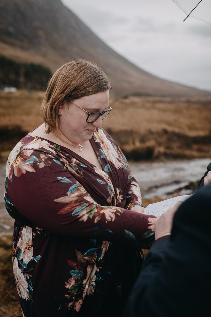 Romantic handfasting in Glencoe during wedding anniversary photoshoot in Scottish Highlands