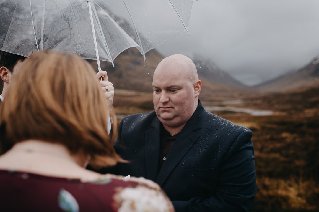 Romantic handfasting in Glencoe during wedding anniversary photoshoot in Scottish Highlands