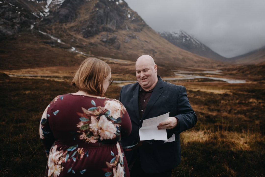 Romantic handfasting in Glencoe during wedding anniversary photoshoot in Scottish Highlands