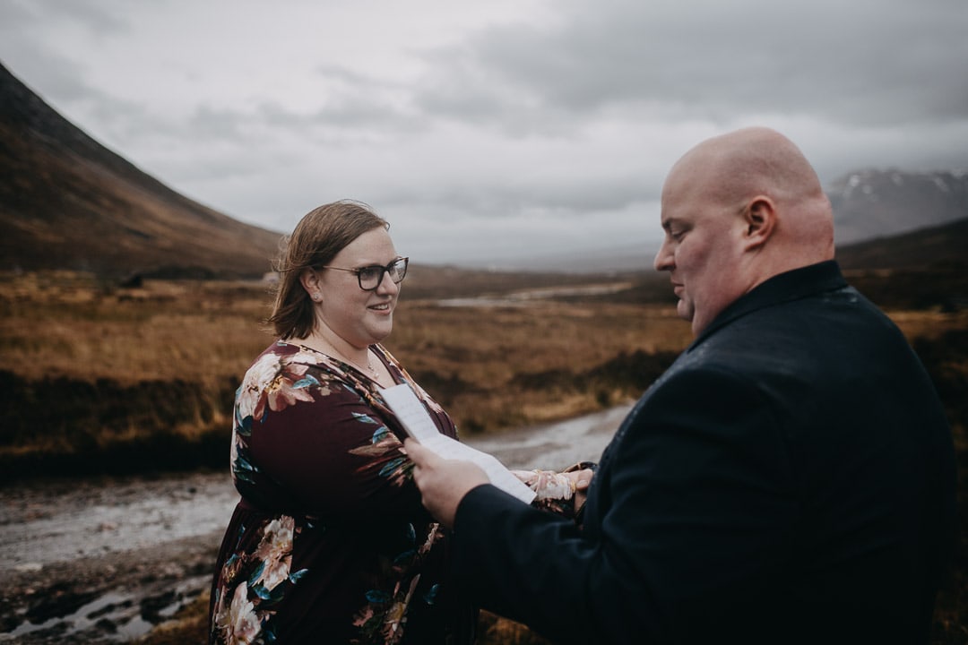 Romantic handfasting in Glencoe during wedding anniversary photoshoot in Scottish Highlands