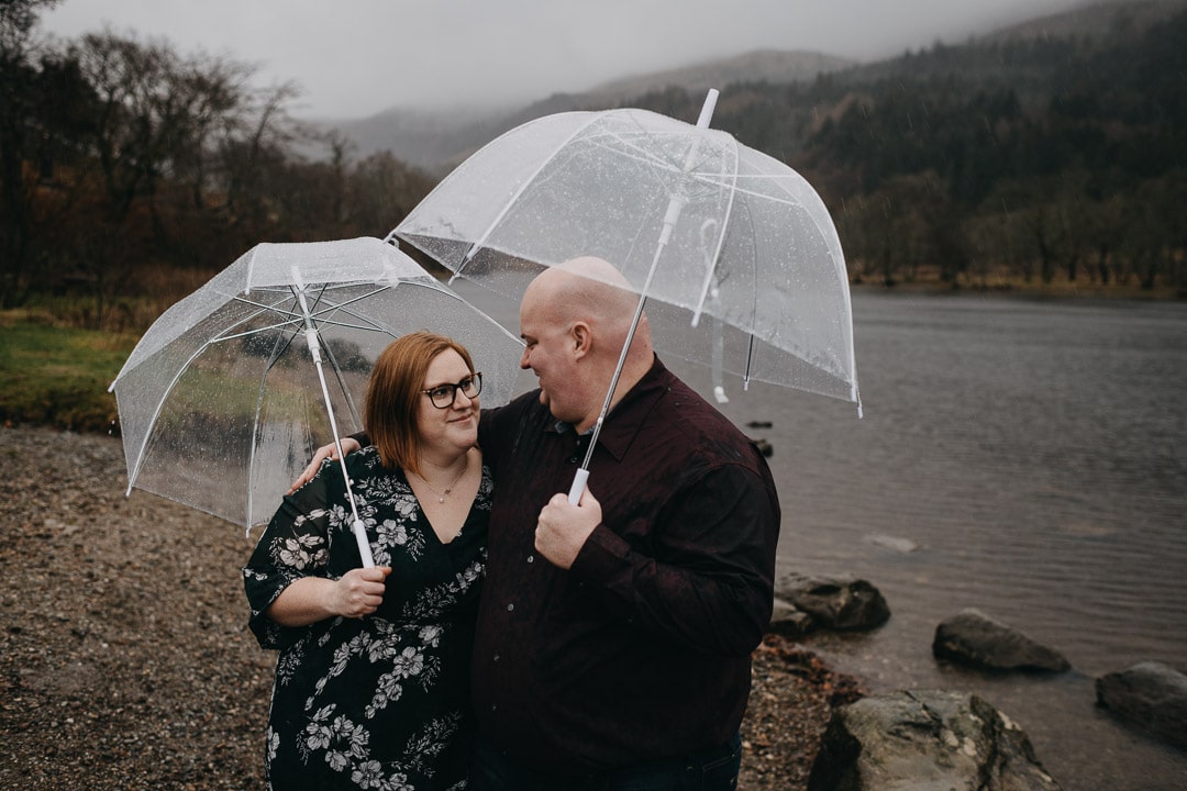 Romantic rainy couples adventure session in the Scottish Highlands - at Loch Lubnaig with umbrellas