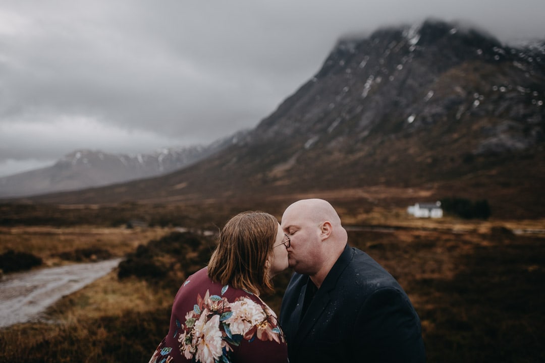 Romantic handfasting in Glencoe during wedding anniversary photoshoot in Scottish Highlands