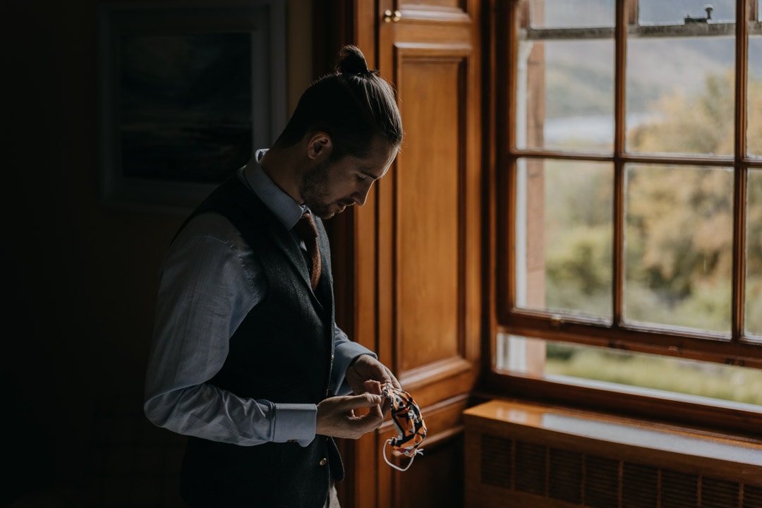 Glencoe elopement getting ready - groom covid mask
