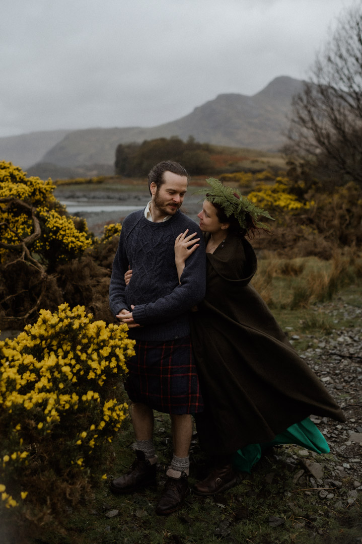 Wet elopement couple on Isle of Mull at the bay