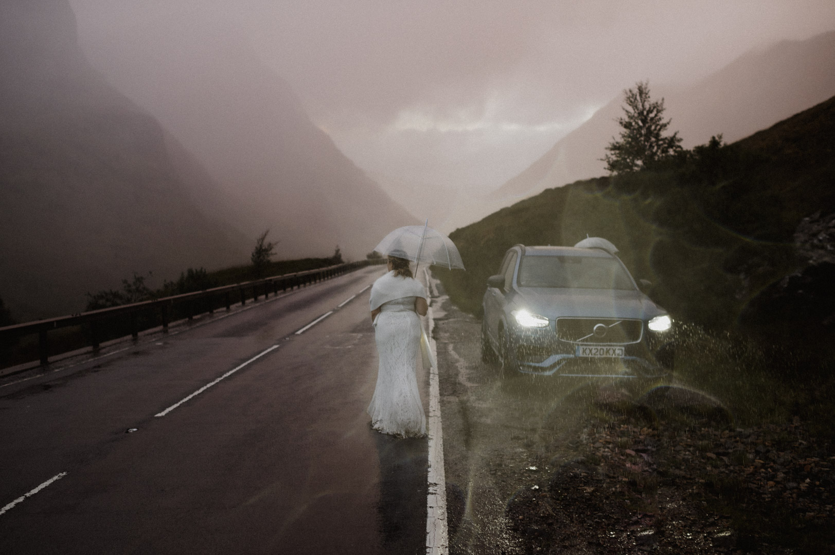 Extreme sunset in Glencoe with bride walking to car