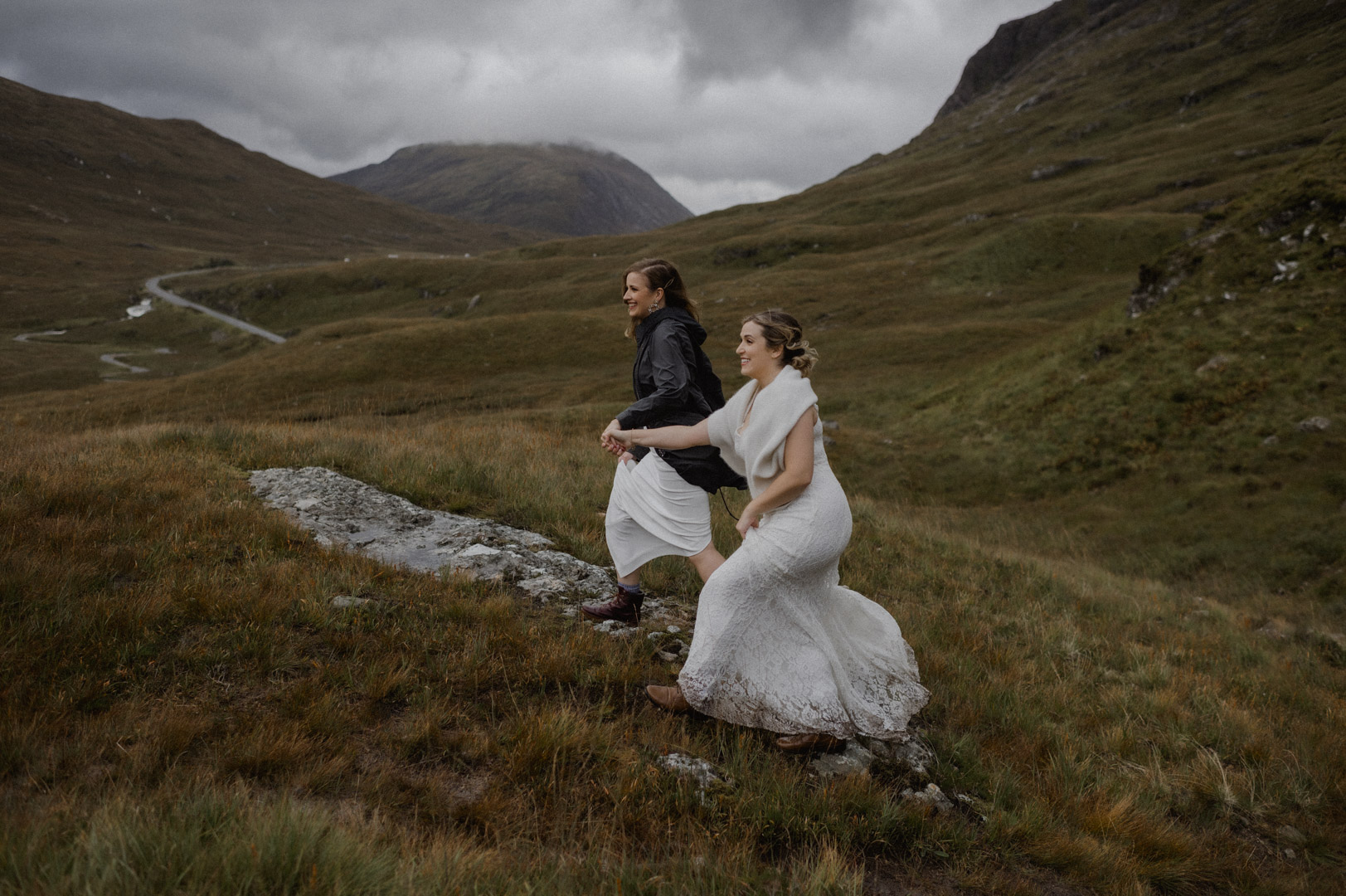 climbing hill to elopement ceremony in Glencoe, Scotland - LGBTQ+