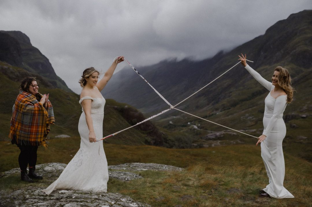 Handfasting during Glencoe elopement - LGBTQ+ lesbian couple