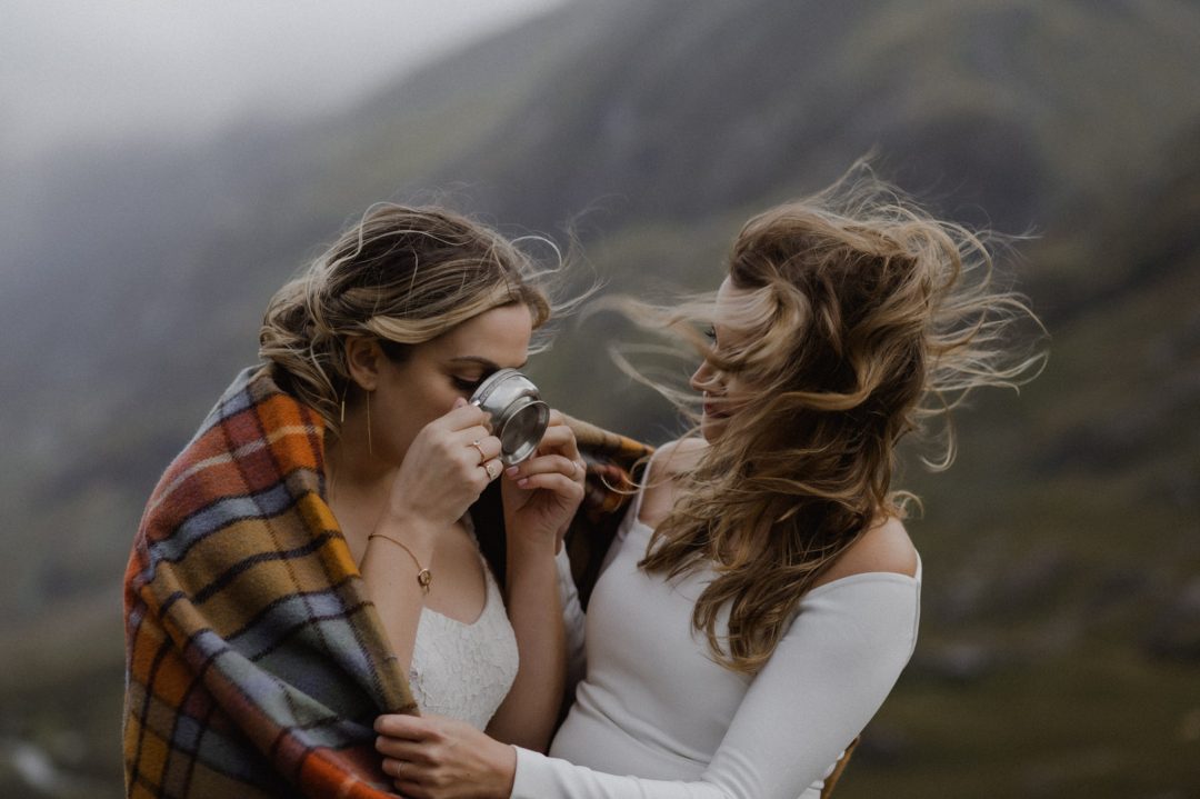 Drinking from the quaich in Glencoe storm elopement - LGBTQ+