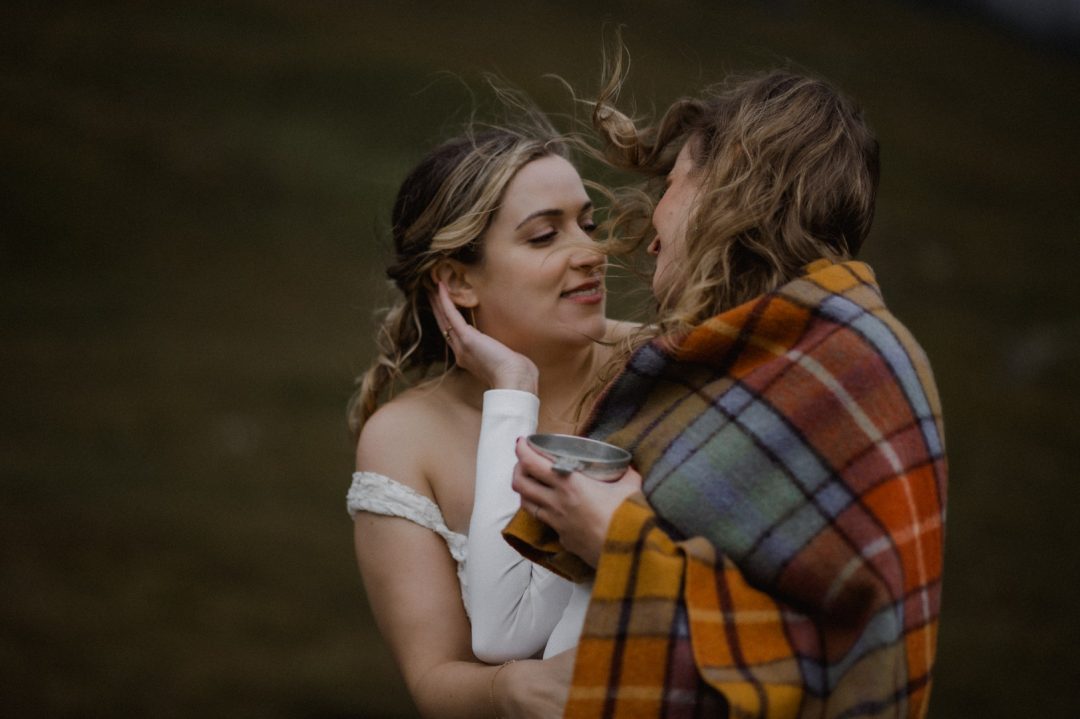 Drinking from the quaich in Glencoe storm elopement - LGBTQ+
