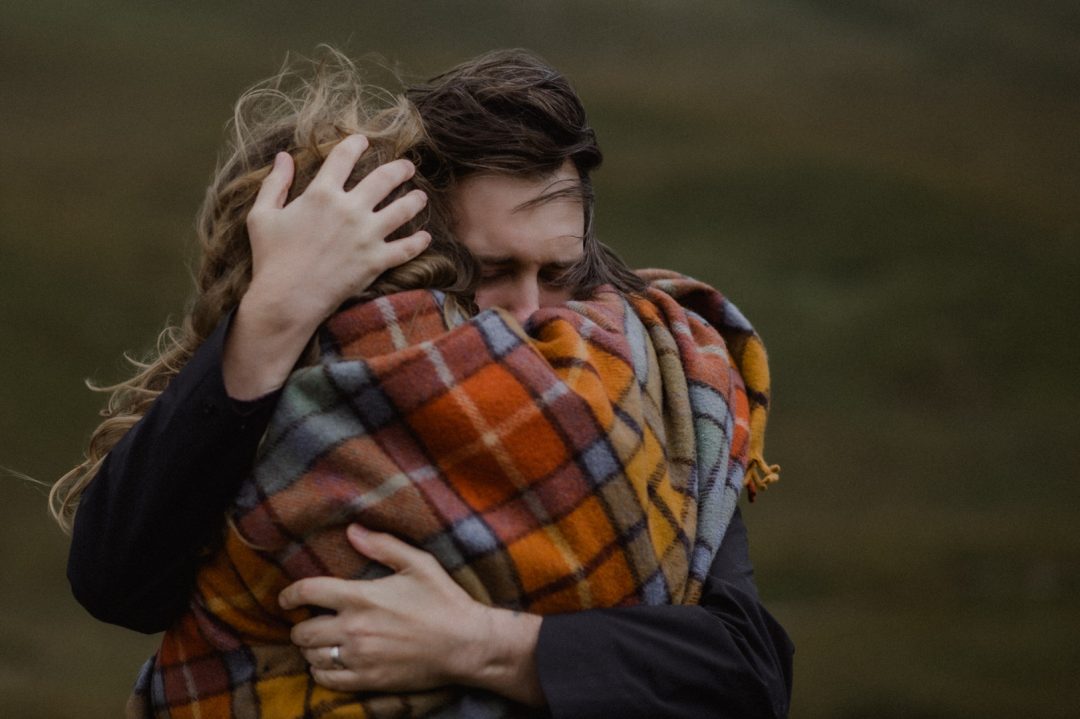 Hugging friend during Glencoe elopement