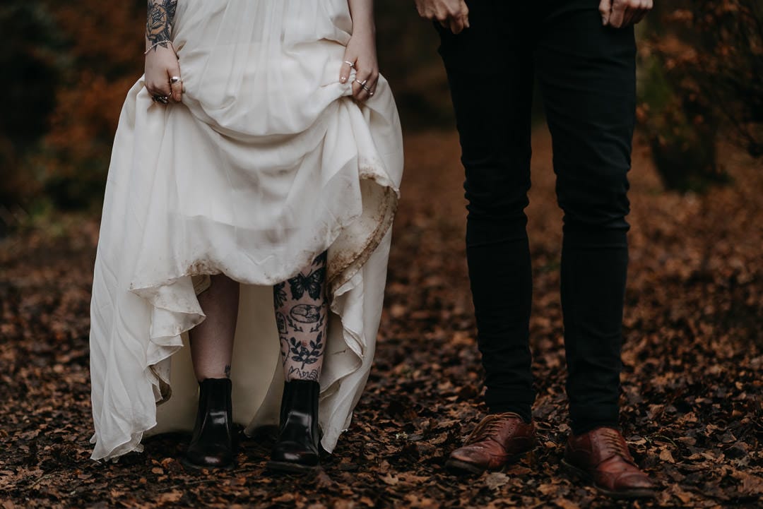 Scottish elopement couples in the woods with dirty dress - adventurous tattooed wedding couple