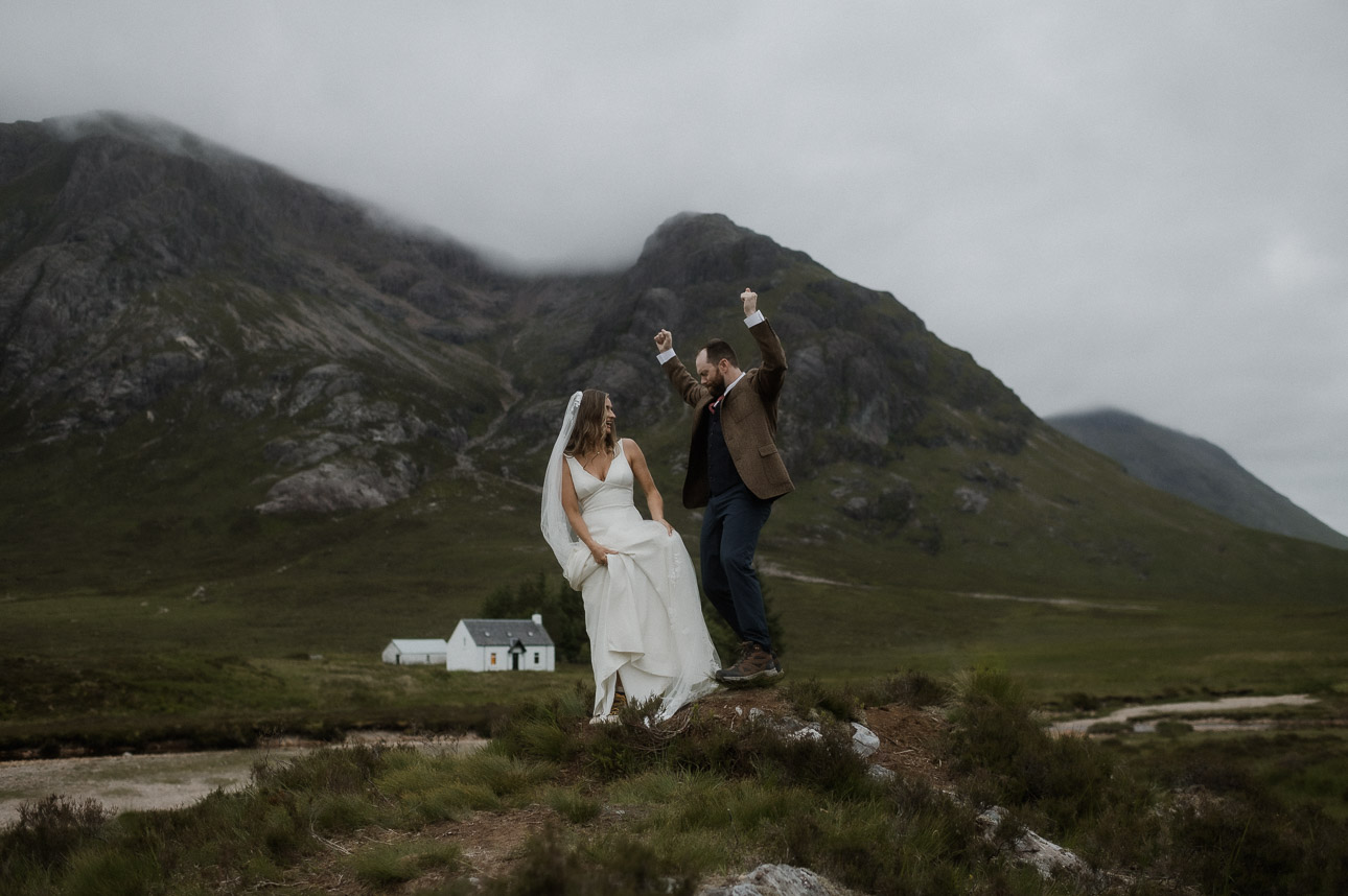 Couple dancing at the wee white cottage whilst eloping in Glencoe